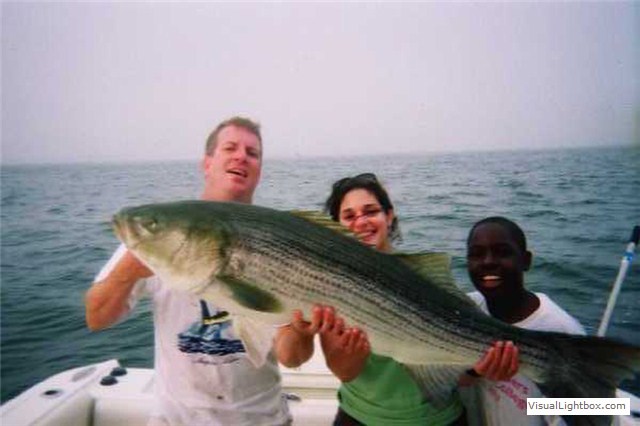 guest holding their catch (trophy photo)